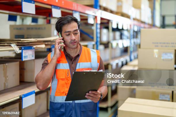 Man Warehouse Manager Using Mobile Phone Talking With Customer Warehouse And Logistic Business Concept Stock Photo - Download Image Now