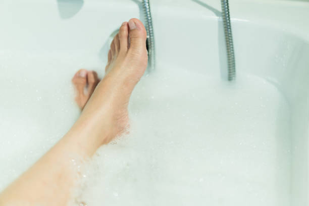 istock Woman enjoy taking a bath and shower. 1393631889