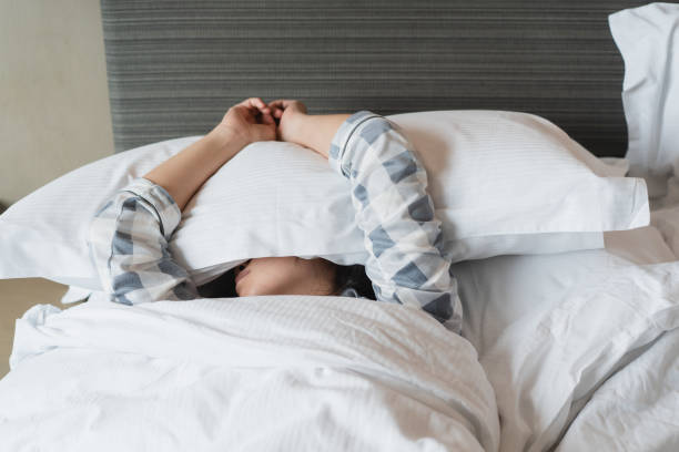 istock Lazy woman sleeping on the bed. 1393631912