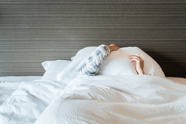 istock Lazy woman sleeping on the bed. 1393631933