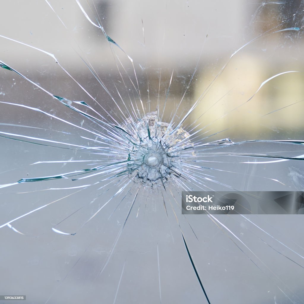 destroyed window pane at a store destroyed window pane from safety glass at a store Rebellion Stock Photo