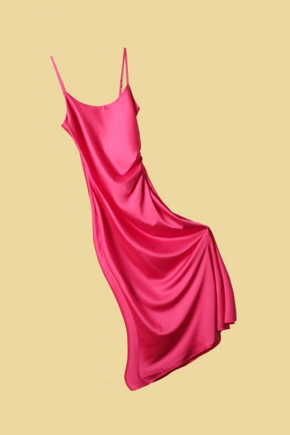 Studio shot of floating long silk camisole dress stock photo