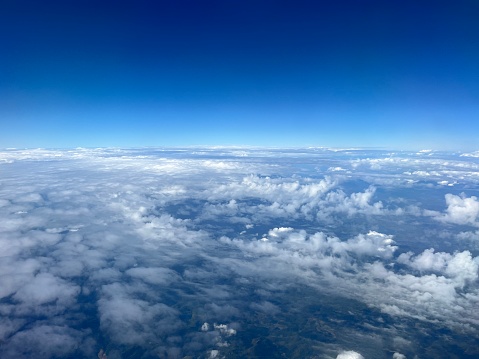 Cloud and blue sky from the airplane windows