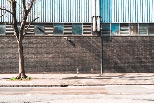 Industrial building background Industrial building background empty road with trees stock pictures, royalty-free photos & images