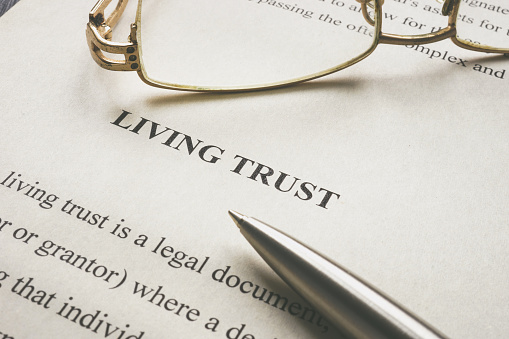 Information about Living trust and glasses on it.