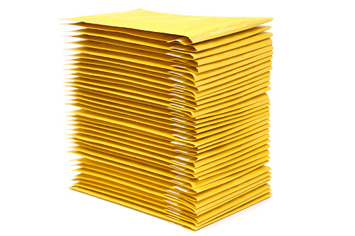 Stack of shockproof padded envelopes isolated on white