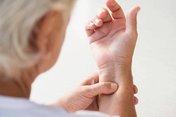 istock Old Woman Counting The Pulse 1393639905