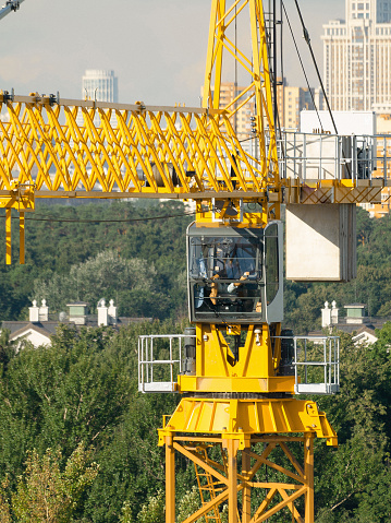 unrecognizable workman operator have a rest in construction crane cabin