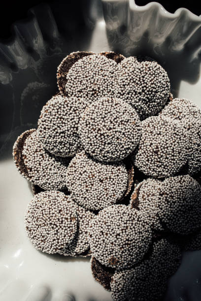istock dark chocolate nonpareils with white sprinkles 1393642833