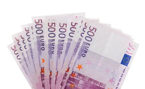 A fan of €500 bills isolated against a white background