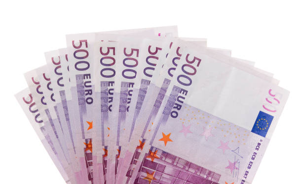 a fan of €500 bills isolated against a white background - five hundred euro banknote imagens e fotografias de stock