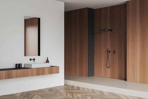 istock Corner view on bright bathroom interior with shower, mirror, sink 1393651137