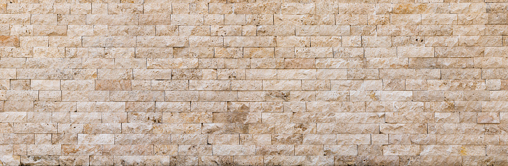 Abstract beige brick wall panoramic background