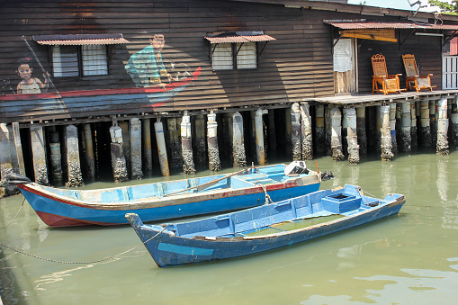 Georgetown, Penang, Malaysia - November 2012: The traditional stilt houses in the Clan jetties of a waterside village in George Town.