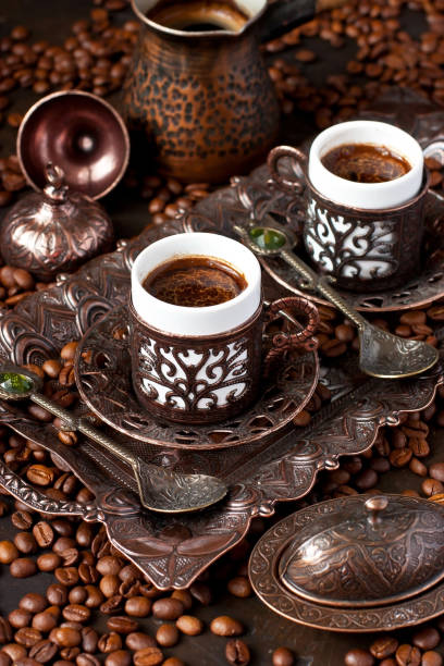 istock Hot coffee in Turkish copper  pot, traditional mugs  and coffee beens 1393653821