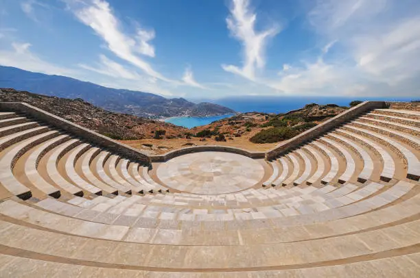 The open-air theatre Odysseas Elytis made of stone and marble in the ancient Greek style on Ios Island. Cyclades Islands, Greece