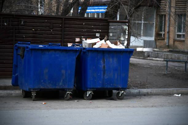 istock Garbage containers and bags with garbage on the street 1393654879