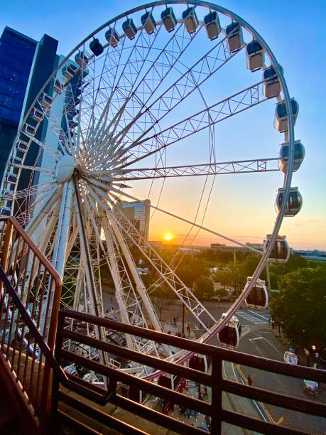 istock A sunset with a city view and ferris wheel in the foreground 1393656302