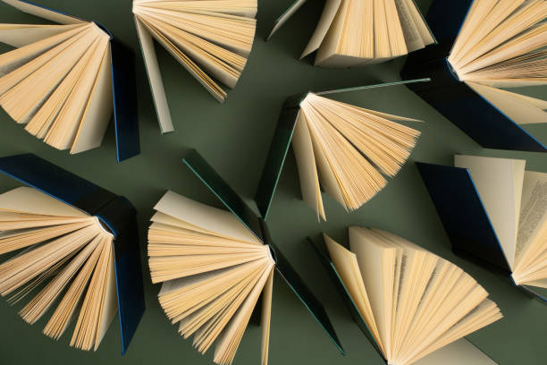 istock Creative pattern made of old books. Used hardback books. Education background. Top view. 1393656359