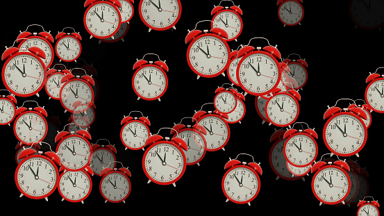 Flying red alarm clocks on black background, 3d render.