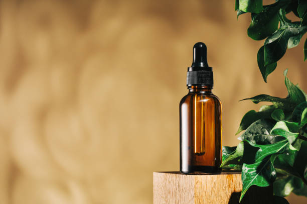 natural medicine or aroma oil concept vial with dropper - homeopatic medicine imagens e fotografias de stock