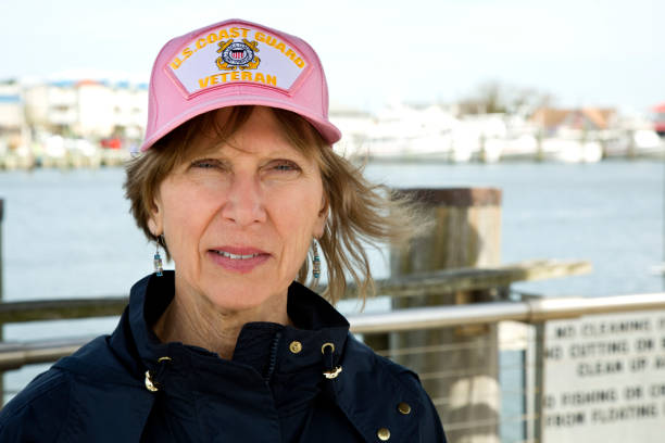 Female U.S. Coast Guard Veteran wearing cap looking at camera