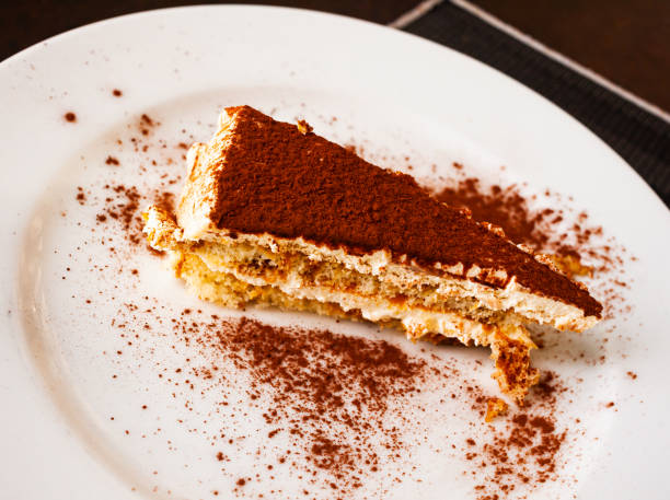 istock Sponge cake with butter cream and chocolate powder 1393664634