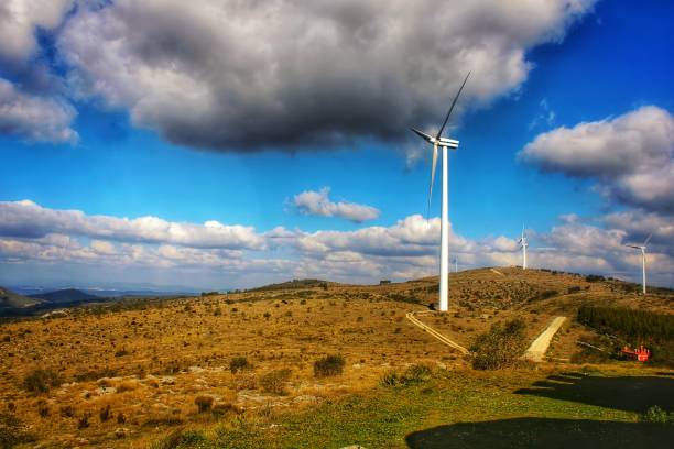 istock View over the mountains and wind turbines, blue sky with many clouds 1393664876