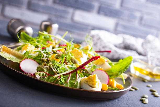 istock fresh salad, salad with avocado and boiled eggs 1393665094