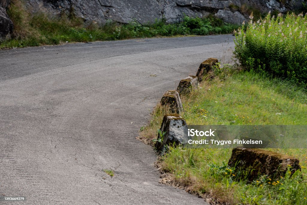 Old concrete barriers by the side of a road.. Old concrete barriers by the side of a road. Hydroelectric Power Stock Photo