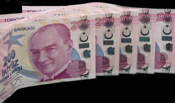 200 Turkish lira ranked , money 200 Turkish liras regularly arranged on the table , money, black background para birimi stock pictures, royalty-free photos & images