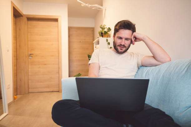 istock Caucasian man buying a plane ticket on the laptop 1393673456
