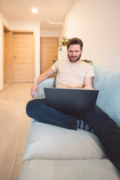 istock Caucasian man buying a plane ticket on the laptop 1393673471