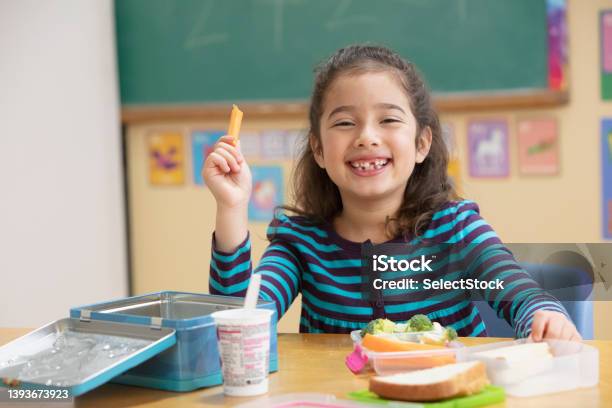 Little Girl Eating Healthy At School Stock Photo - Download Image Now - Healthy Eating, Child, Snack