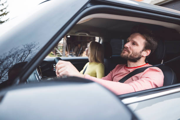istock Happy couple renting a car 1393674096