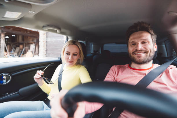istock Happy couple renting a car 1393674132