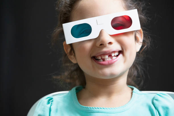 Little girl using 3d paper glasses