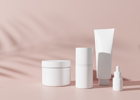 Group of white and blank, unbranded cosmetic cream jars and tubes on pink background. Skin care product presentation. Elegant mockup. Skincare, beauty and spa. Jar, tube with copy space. 3D rendering