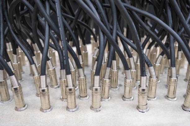 Audio jack cable connected at rear end of mixer at broadcasting,shallow depth of field. Audio jack cable connected at rear end of mixer at broadcasting,shallow depth of field amplifier plug stock pictures, royalty-free photos & images