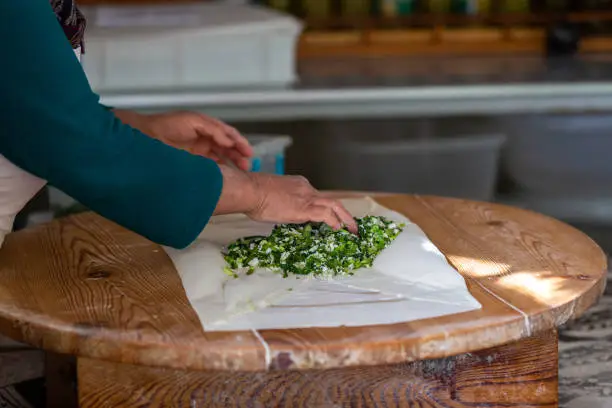 Photo of A woman making pancakes in Antalya, Turkey. SELECTVE FOCUS