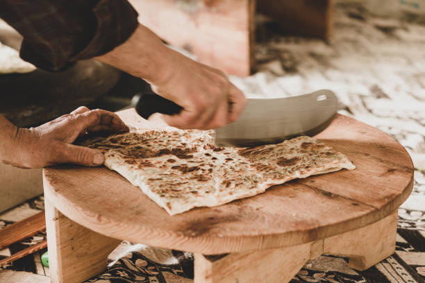 istock Preparing the cooked pancake for service by cutting it. SELEKTVE FOCUS 1393682791