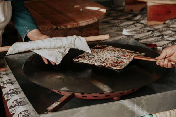 istock Preparing the cooked pancake for service by cutting it. SELEKTVE FOCUS 1393684343