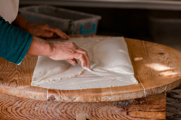 istock Preparing the cooked pancake for service by cutting it. SELEKTVE FOCUS 1393684344