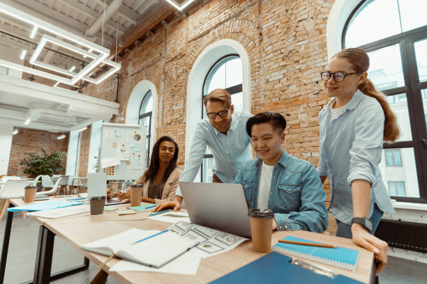 istock Teamwork on laptop on business project in the office 1393686802