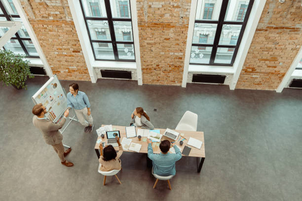 istock Two people shaking hands during a meeting in the office 1393686895
