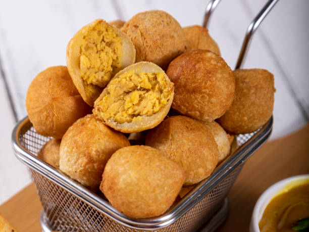 istock Brazilian snacks, fried balls stuffed with chicken 1393686930