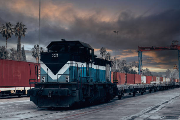 istock Cargo ship unloading from freight train in a commercial port. 1393690513