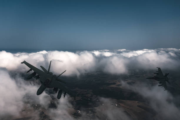 istock Jet fighters flying over the clouds. 1393696857