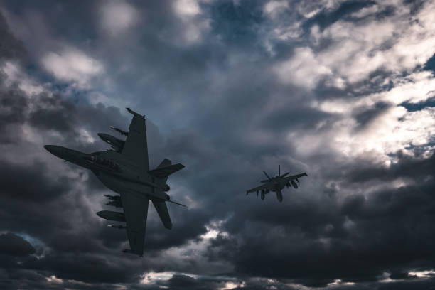 istock Jet fighters flying over the clouds. 1393696887