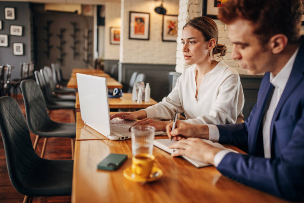 istock Business people sitting in cafe 1393697483